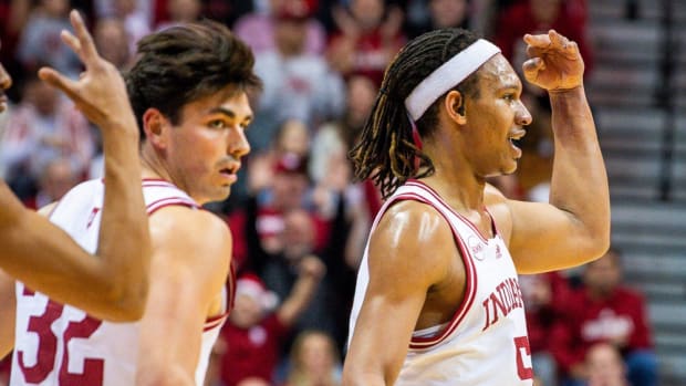 Indiana's Malik Reneau (5) holds up three fingers after making a three-pointer during the first half of the Indiana versus North Alabama men's basketball game at Simon Skjodt Assembly Hall on Thursday, December 21, 2023.